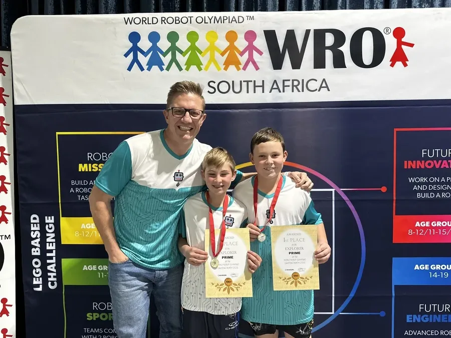 Coach and two students holding 1st Place Explorer Prime certificates