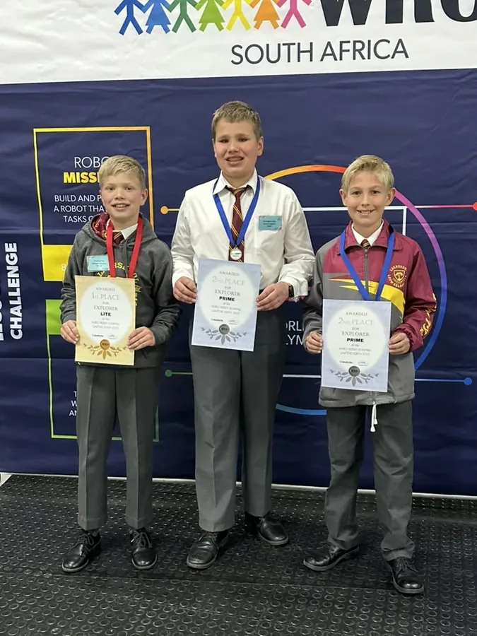 Team holding 1st and 2nd place Explorer certificates, Gauteng North regionals